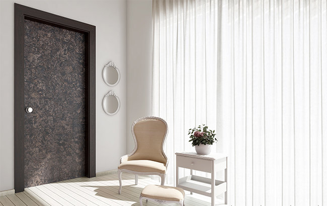 A laminated interior door in a furnished living space